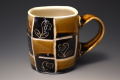 pseudocube checkered amber mug with single lily of the valley motif