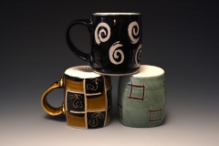 trio of mugs with different designs