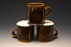 trio of pseudo-cube demitasse in amber with underglazed aperture motif