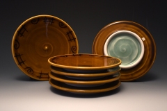 small amber plates with various underglazed motifs