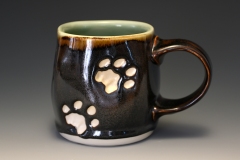 medium mug with cat paw prints.  starry nigh exterior.