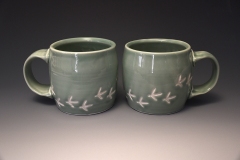 medium mugs with turkey tracks in celadon glaze.