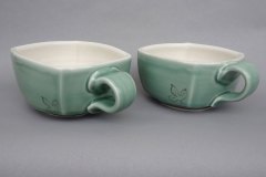 Pseudocubic soup cups: thrown then altered porcelain, celadon glaze with sassafras motif brush applied with slip based on pseudocubic hematite crystals.