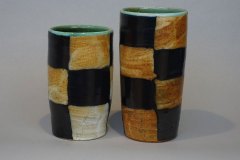 High form beakers for drinking or displaying: black slip checkers, Willie Helix glaze interior, soda fired.