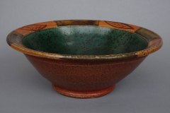 Classic bowl with decorated rim: Willie Helix glaze interior, slip leaves with amber glazed rim, wood fired.