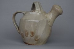 Faceted watering can:  made from local clay (NC), salt over white slip, wood fired.