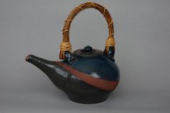 Earl grey teapot: black and copper green glazes on dense earthenware clay, natural vine handle.